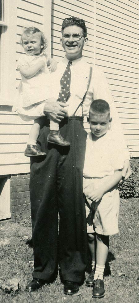 1944, Edgar holding Barbara with Ed standing.