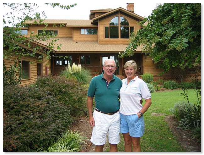 Dick and Jan Phillips by their house.